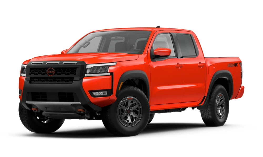 2026 Nissan Frontier in Afterburn Orange, full vehicle front three-quarter view facing left