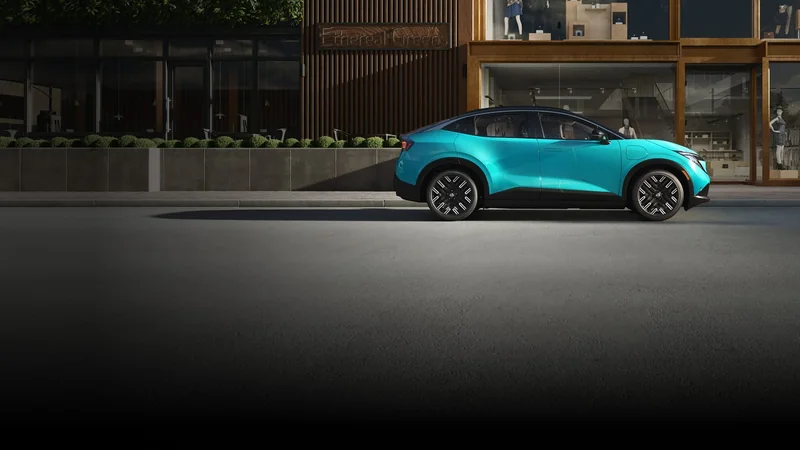 Blue third-generation 2026 LEAF in side profile on an urban street