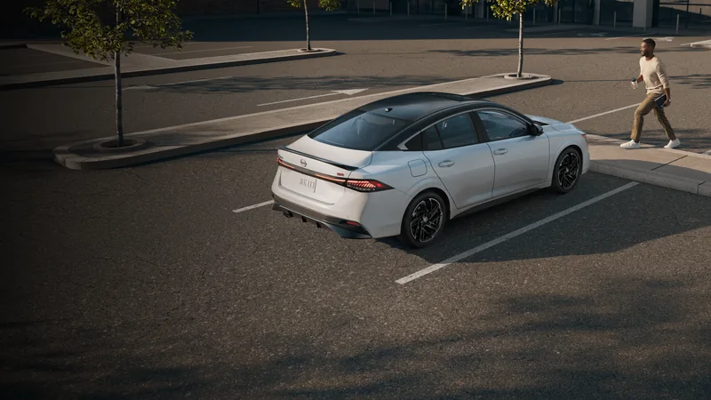 Silver all-new Sentra from an elevated rear three-quarter angle on a city street