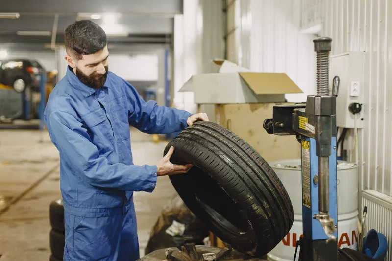 Mechanic inspecting a tire