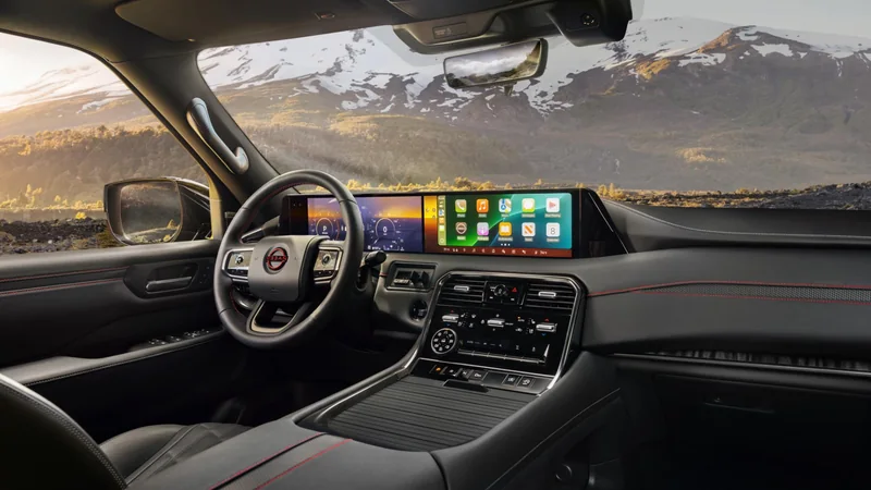 A modern Nissan Armada cabin showing the front seats and dashboard