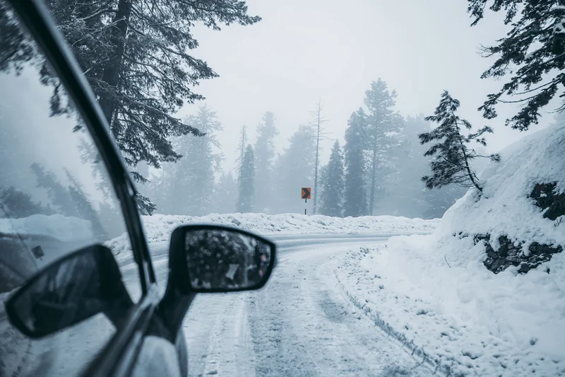 Car on a snowy mountain road